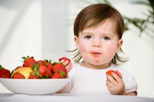 toddler-with-strawberries